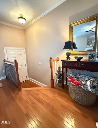 a bedroom with furniture and a mirror