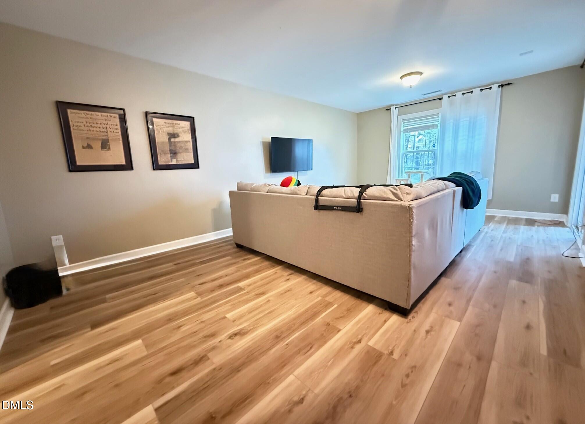 4008 Abbey Park Way Raleigh, NC 27612 - Photo 23 of 28 a living room with a bed furniture and a window