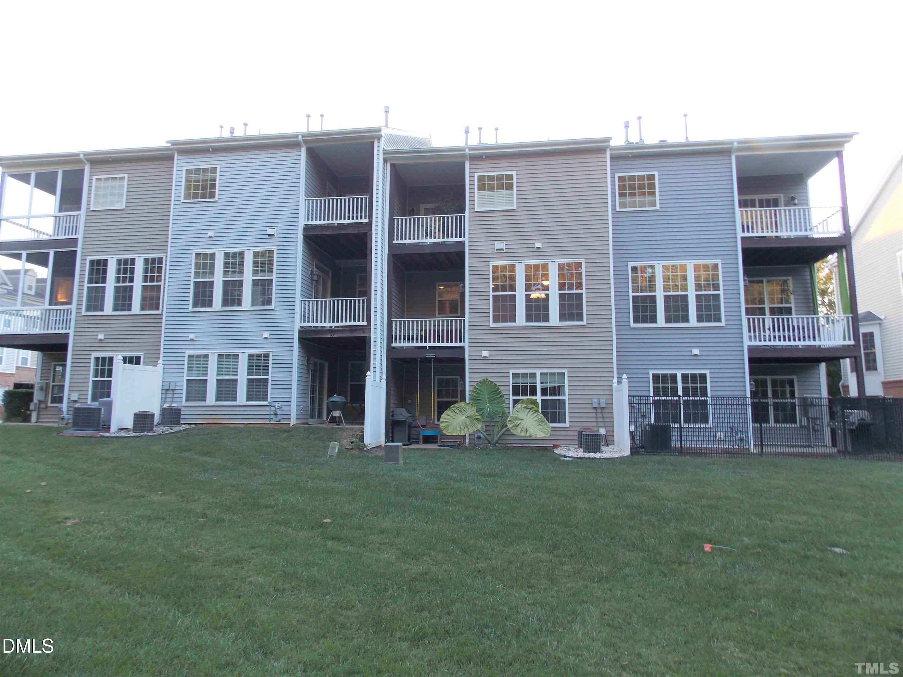4008 Abbey Park Way Raleigh, NC 27612 - Photo 25 of 28 a large building with a yard