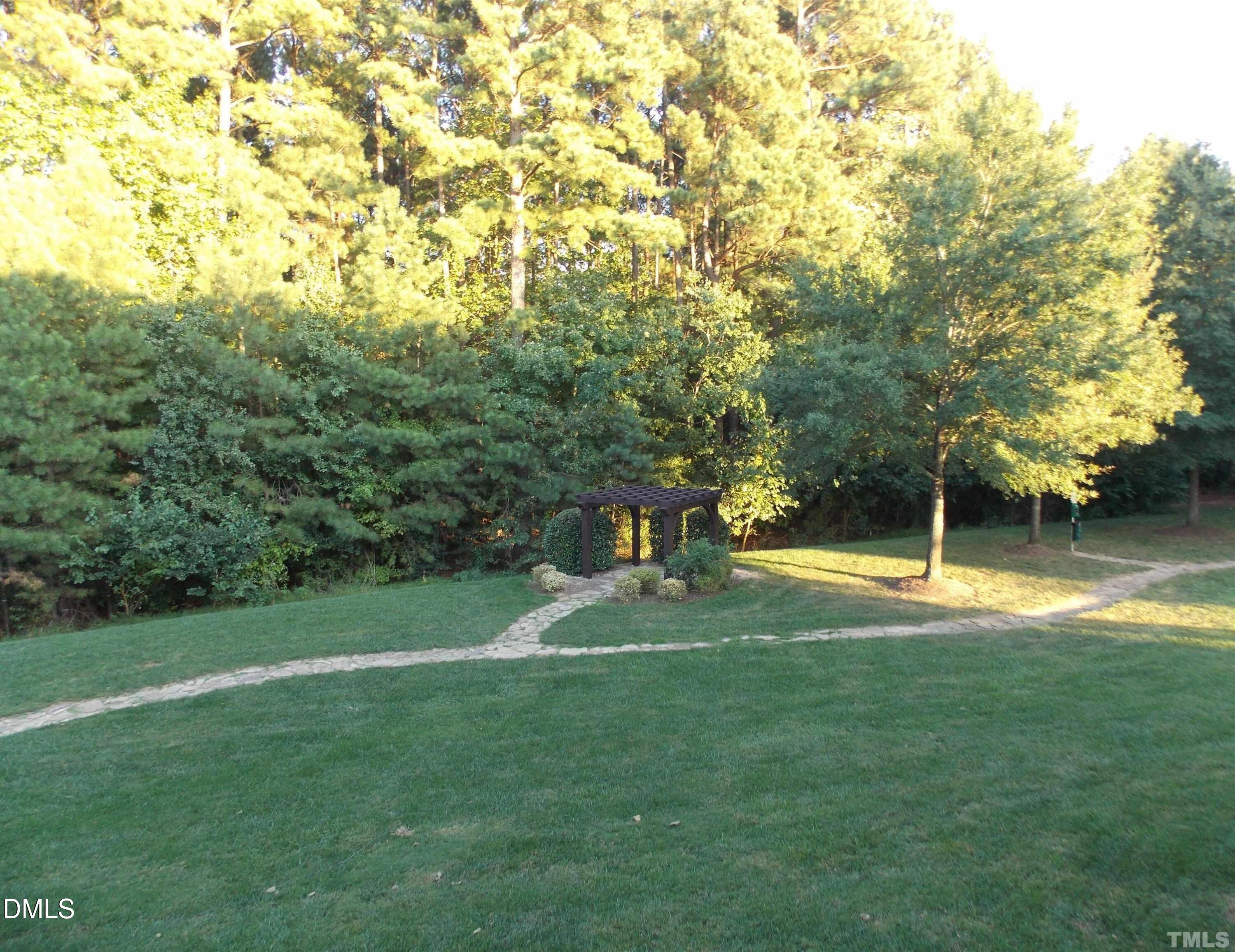4008 Abbey Park Way Raleigh, NC 27612 - Photo 26 of 28 a view of a playground with a house