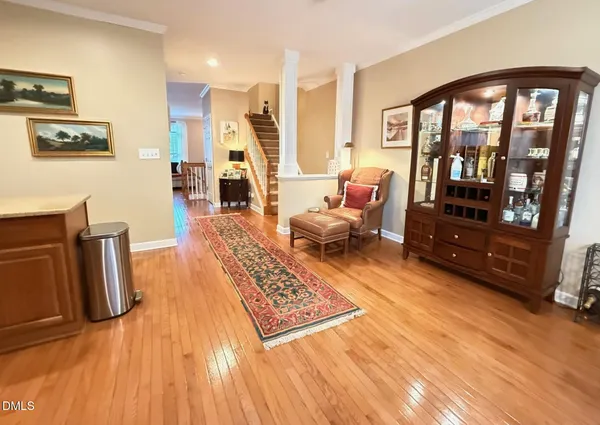 a living room with furniture and a rug
