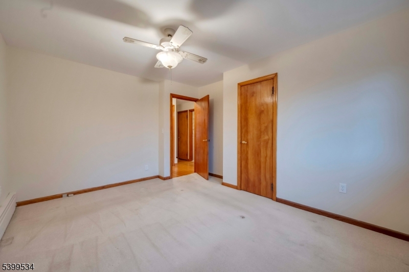 44 Beavers Street High Bridge, NJ 08829 - Photo 18 of 28 a view of an empty room with a chandelier fan
