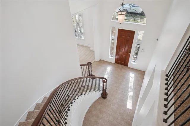 an entryway with a chandelier