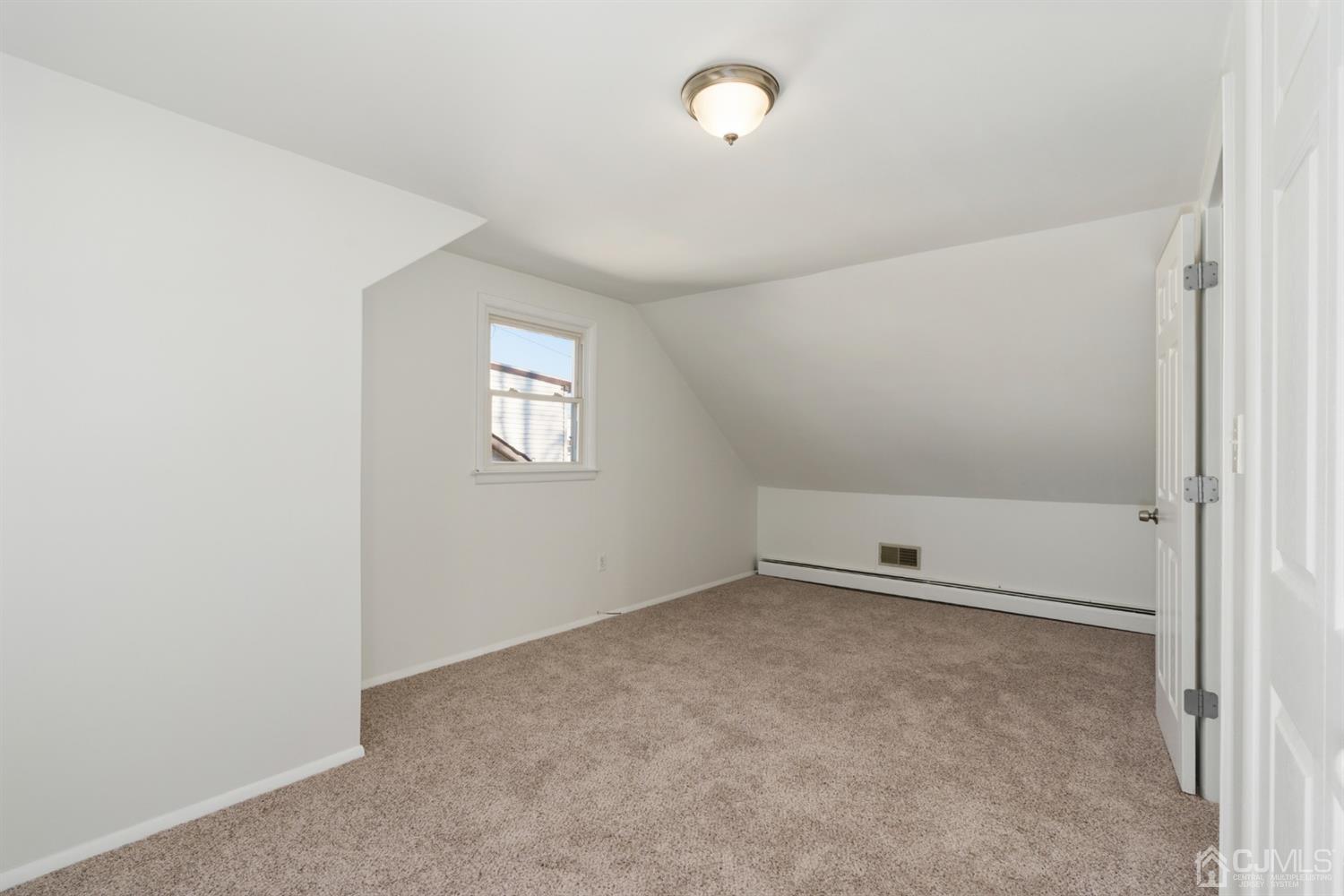 403 Fulton Street Middlesex, NJ 08846 - Photo 14 of 31 an empty room with windows