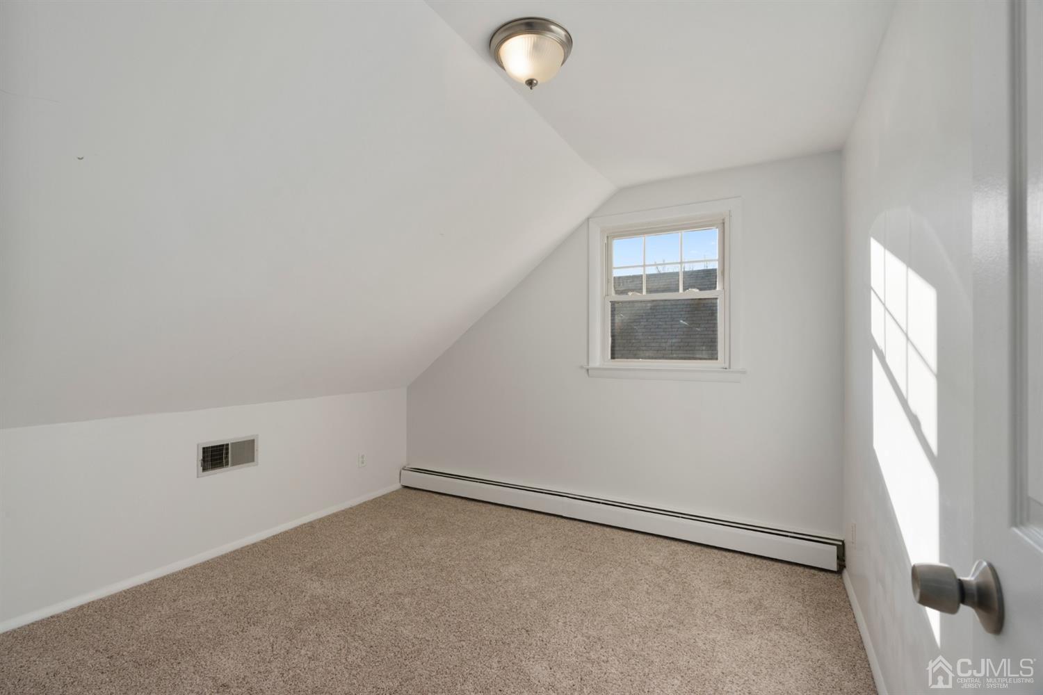403 Fulton Street Middlesex, NJ 08846 - Photo 16 of 31 an empty room with windows and closet