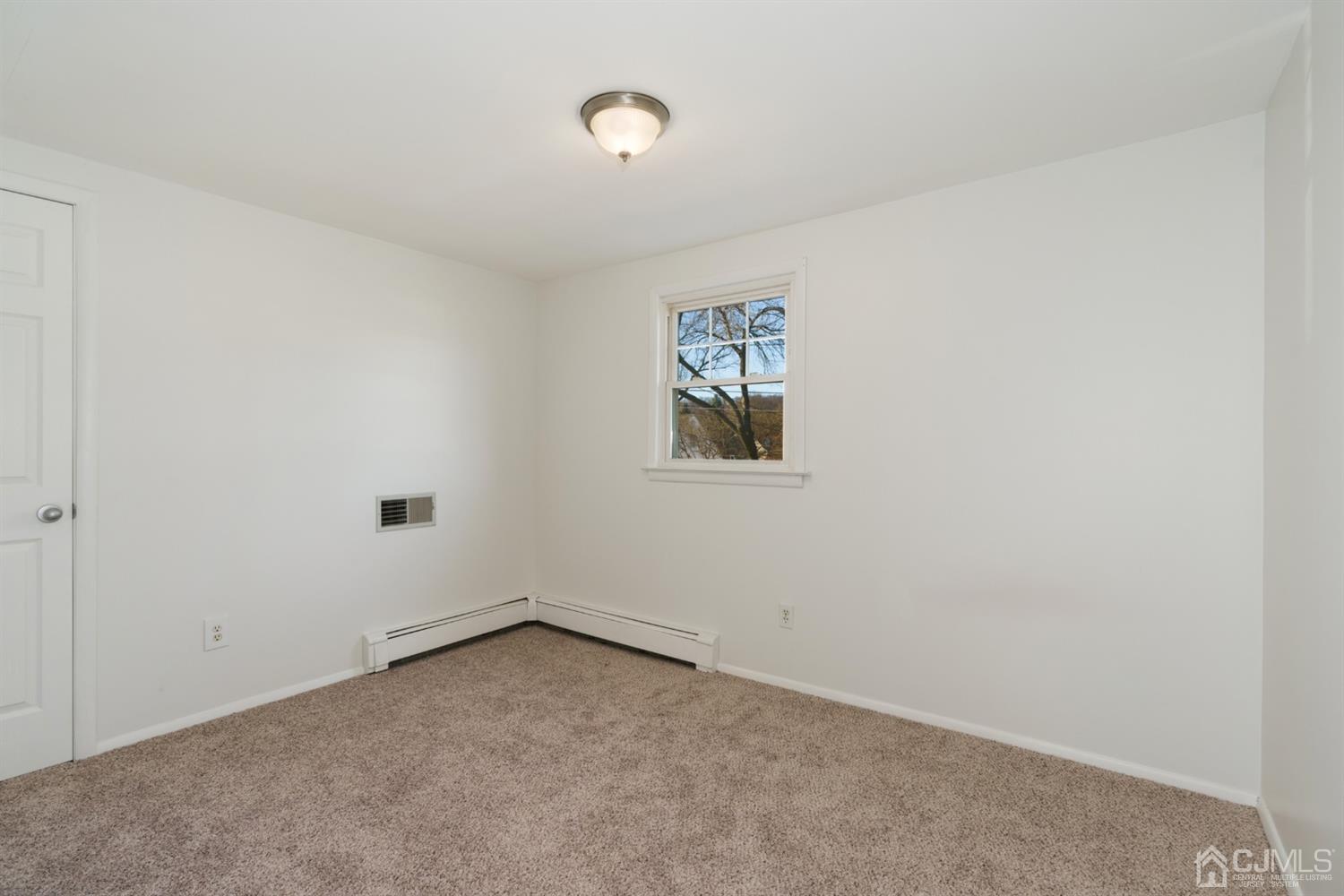 403 Fulton Street Middlesex, NJ 08846 - Photo 17 of 31 an empty room with a window