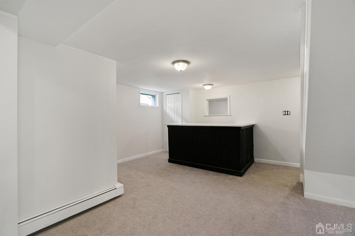 403 Fulton Street Middlesex, NJ 08846 - Photo 20 of 31 a room with a bench in it