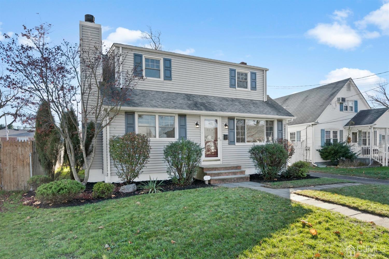 403 Fulton Street Middlesex, NJ 08846 - Photo 28 of 31 a front view of a house with a yard and potted plants