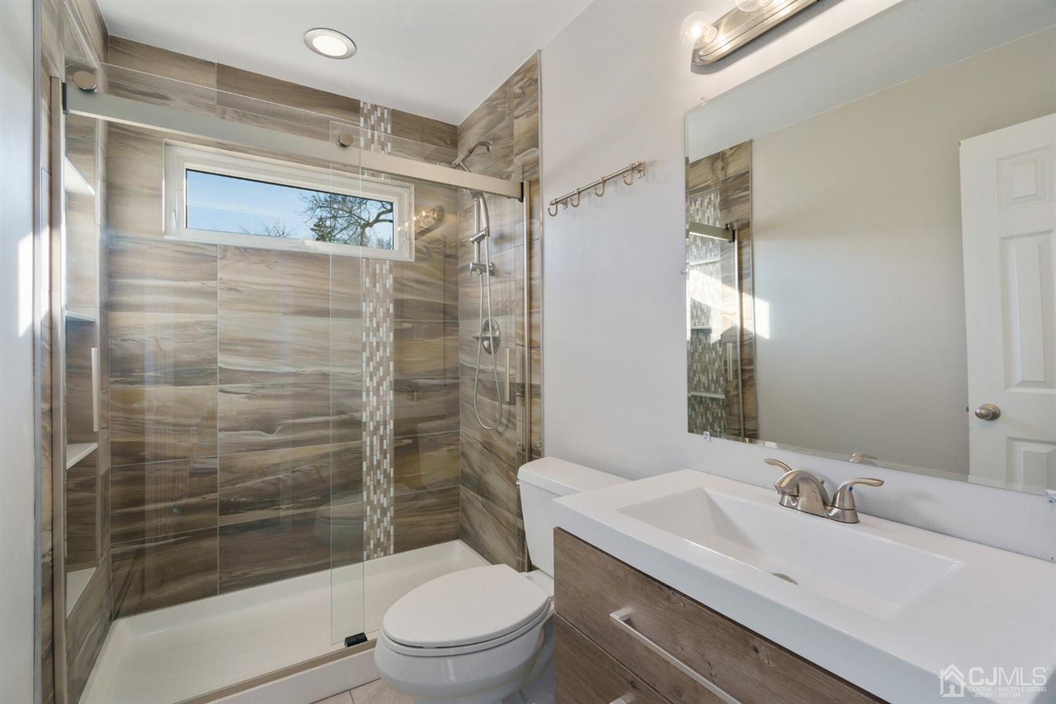 403 Fulton Street Middlesex, NJ 08846 - Photo 7 of 31 a bathroom with a sink a toilet and shower