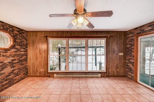a kitchen with stainless steel appliances kitchen island granite countertop a stove a sink and a refrigerator