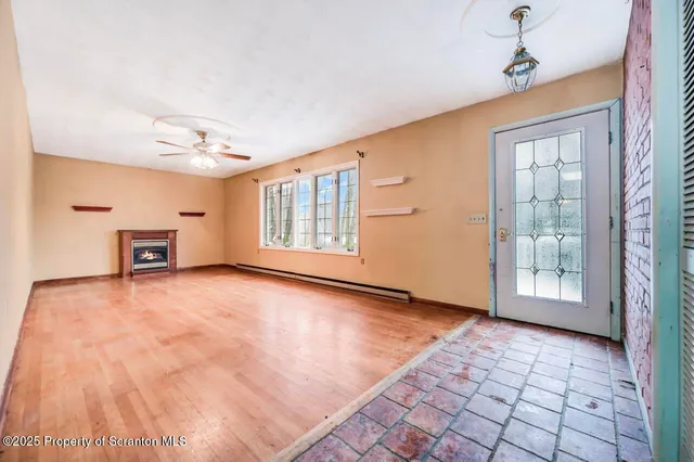 a view of an empty room with a window