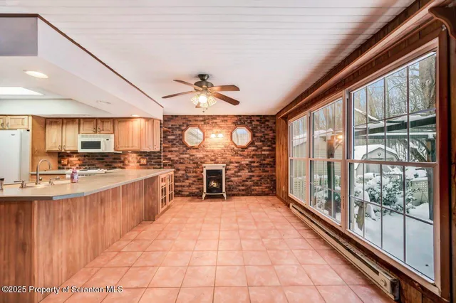 a view of kitchen with windows
