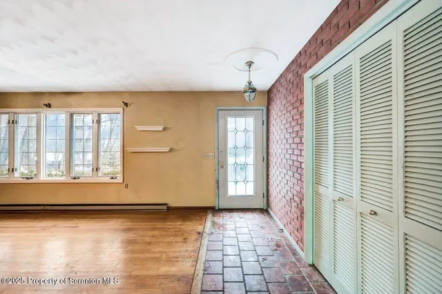 a view of a hallway with a chandelier