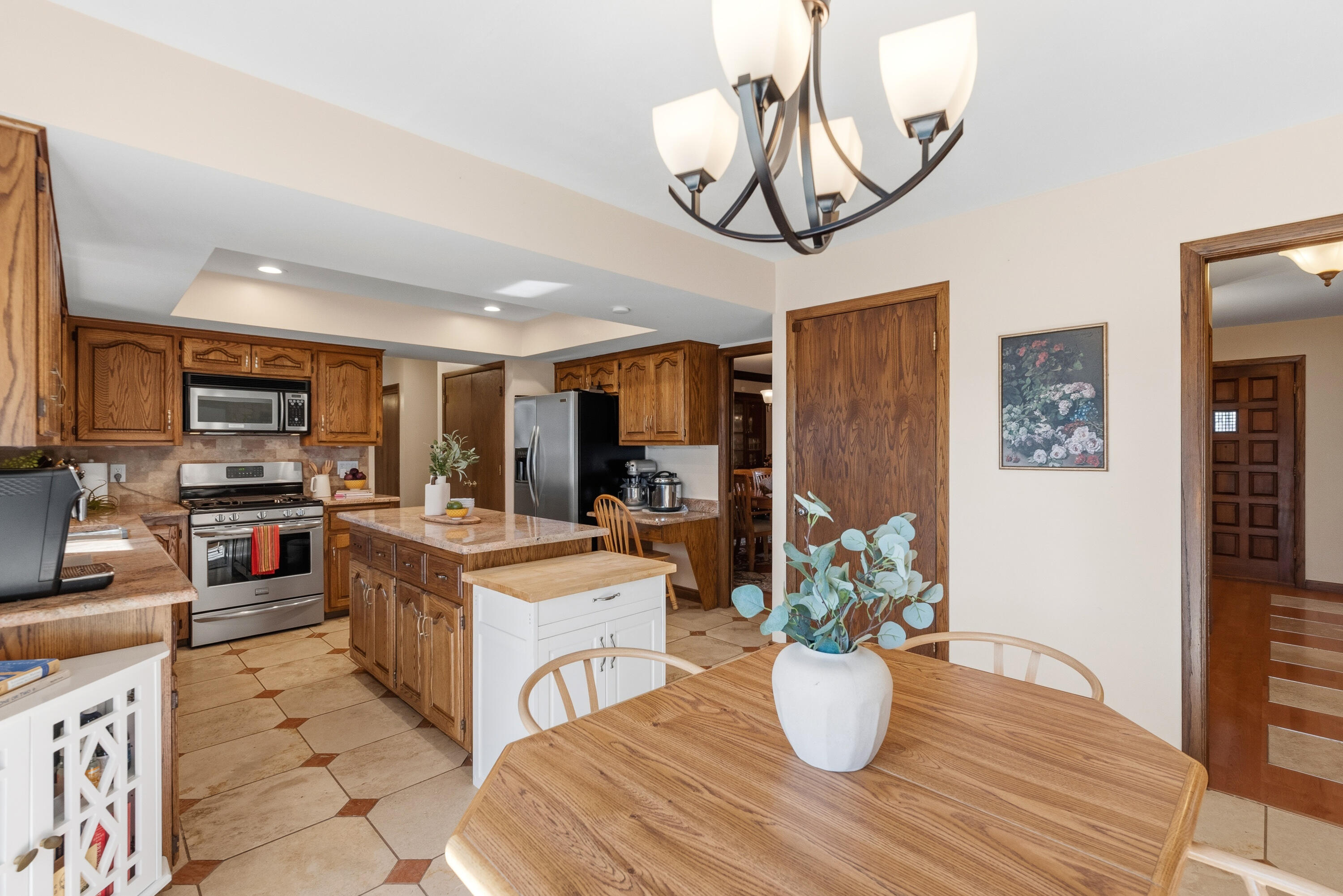 12785 West Bobwood Road New Berlin, WI 53151 - Photo 10 of 39 Lots of Room! Plus a huge pantry. Tile Floors with Marble Accent, Travertine Backsplash (per prior owner)