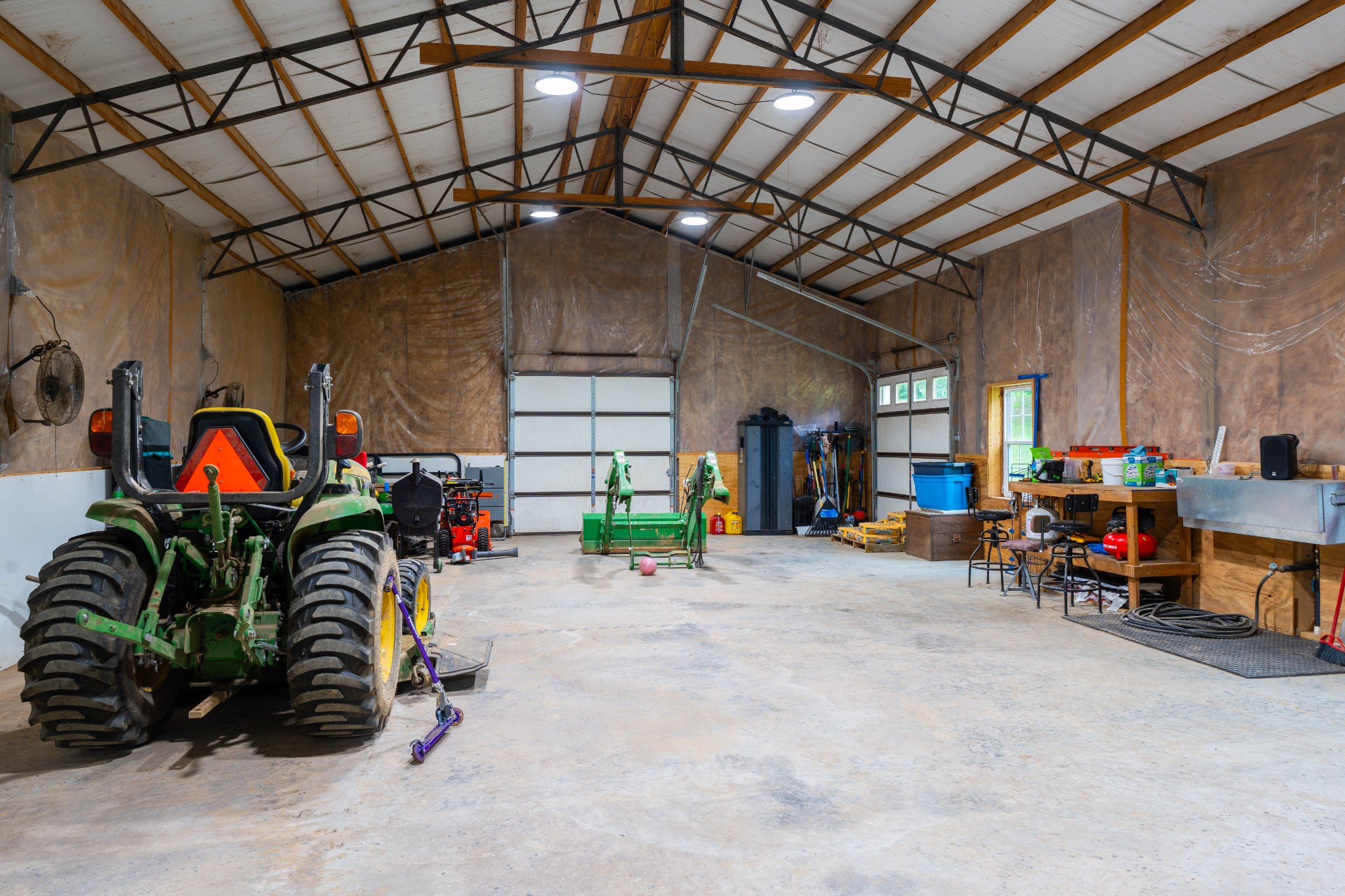 1015 Kelly Road Dyersburg, TN 38024 - Photo 37 of 41 a view of a garage with a bike and a roof