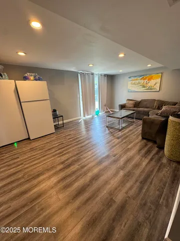 a view of a living room a dining room and wooden floor