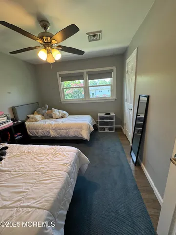 a bedroom with bed and window