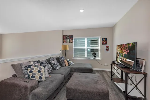 a living room with furniture and a window