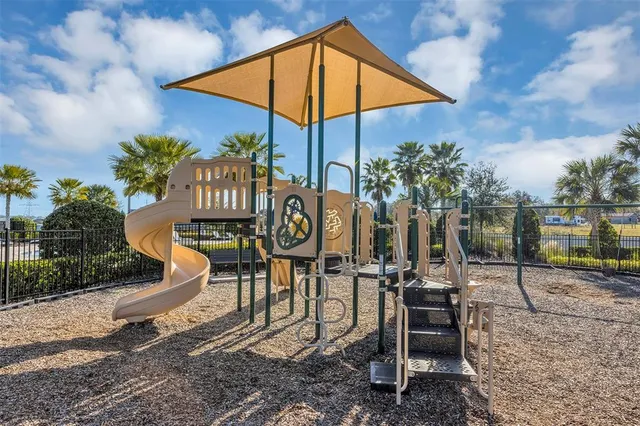 a front view of a house with a yard and a garage
