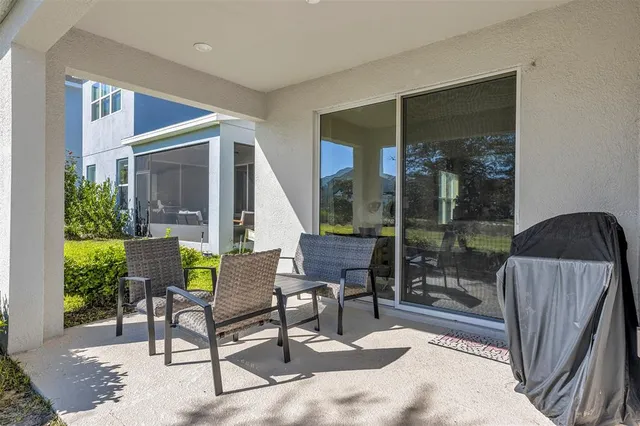a view of a two chairs in the patio