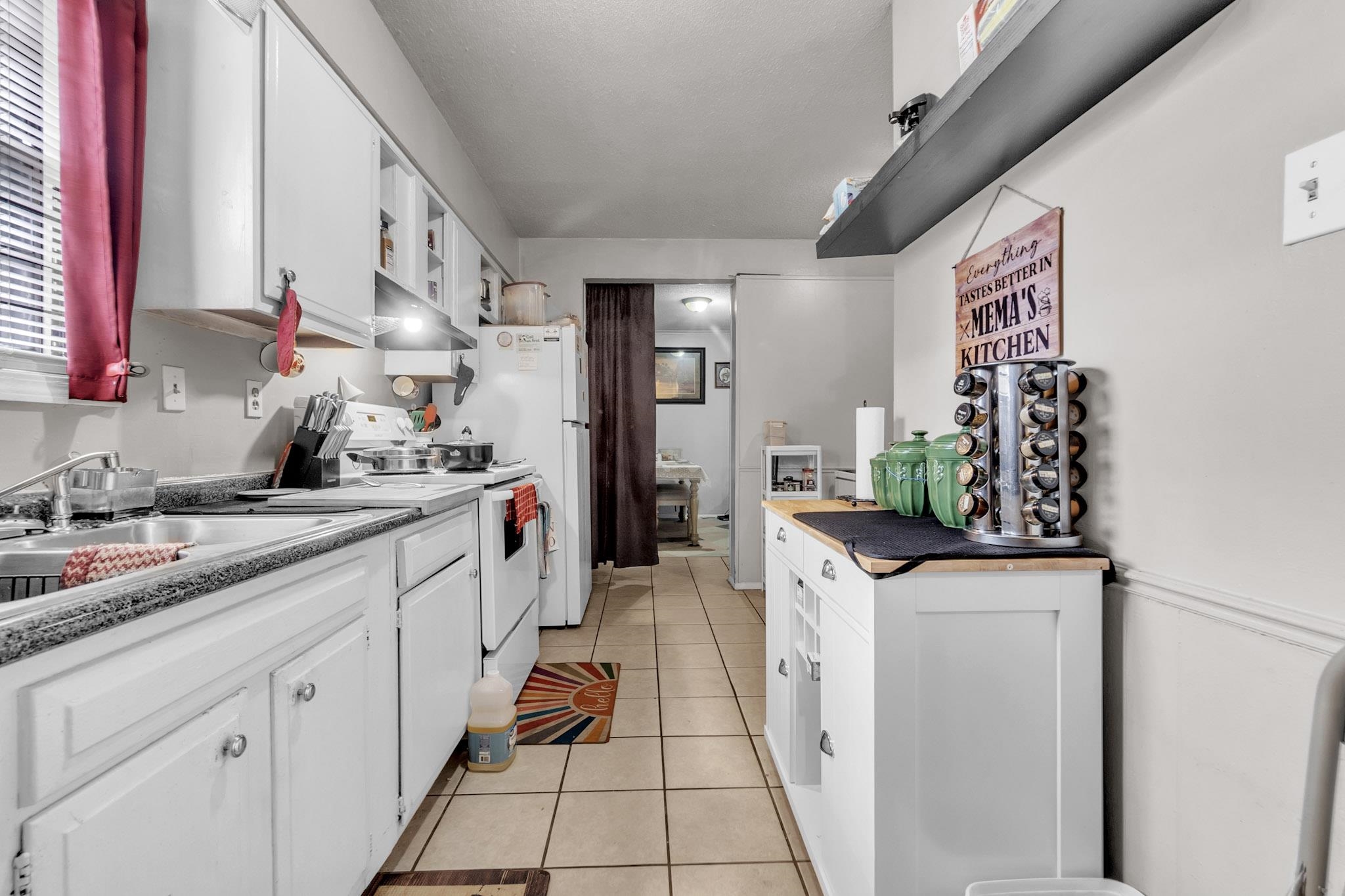 4905 Fernbrook Drive Memphis, TN 38118 - Photo 5 of 9 a kitchen with stainless steel appliances a sink and a stove