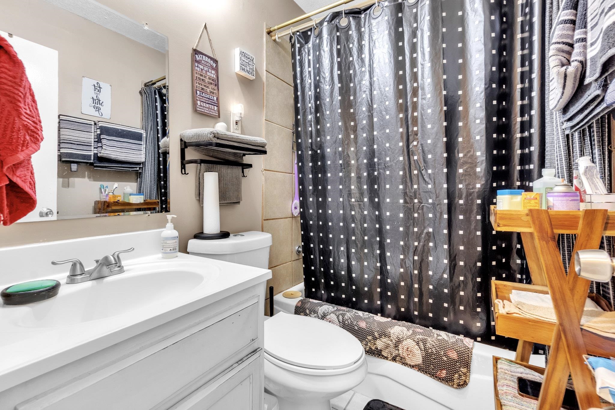 4905 Fernbrook Drive Memphis, TN 38118 - Photo 6 of 9 a bathroom with a sink toilet and shower