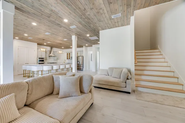 a kitchen with stainless steel appliances kitchen island granite countertop a sink and cabinets