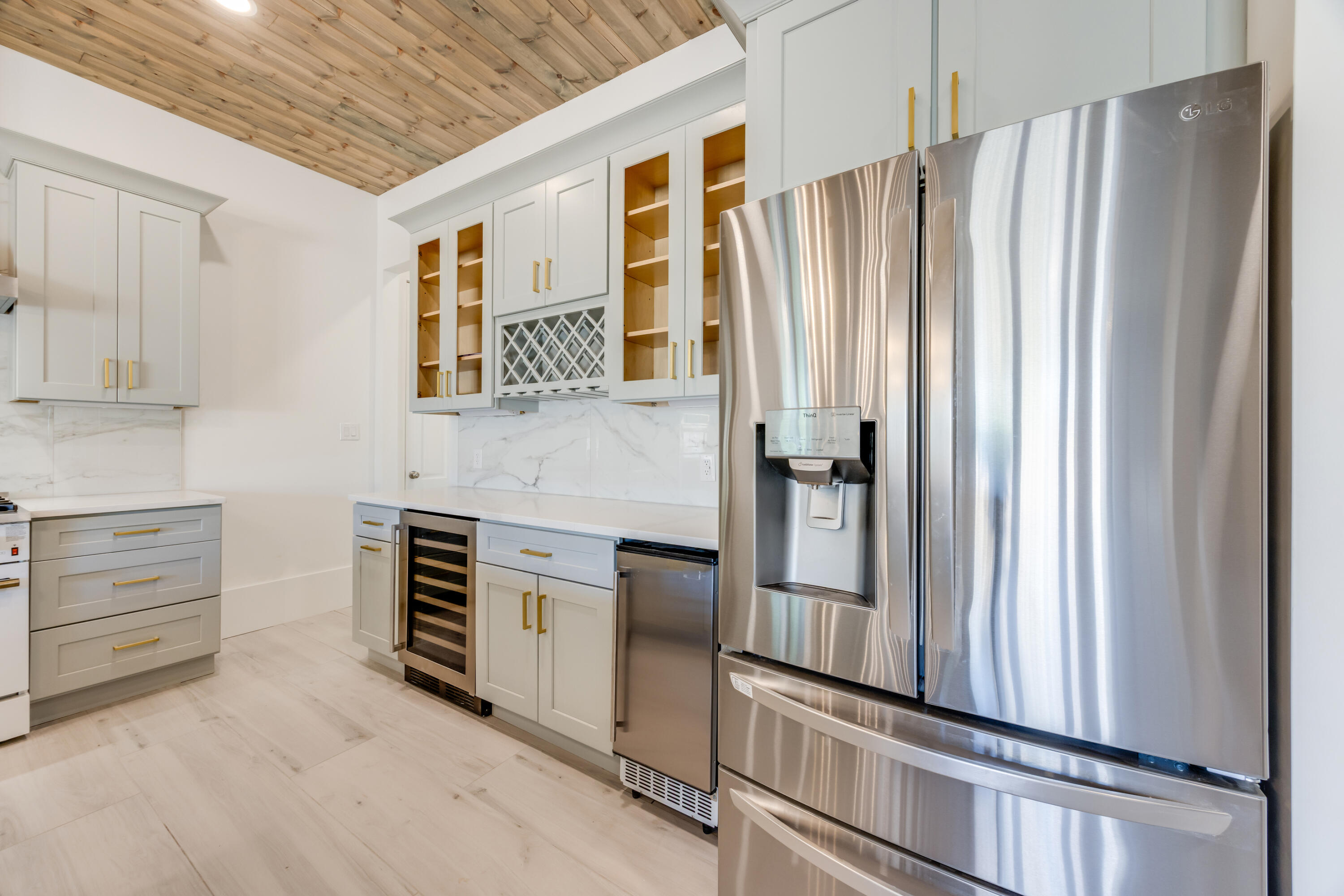 41 Mobile Street Miramar Beach, FL 32550 - Photo 19 of 80 a kitchen with stainless steel appliances a refrigerator and cabinets