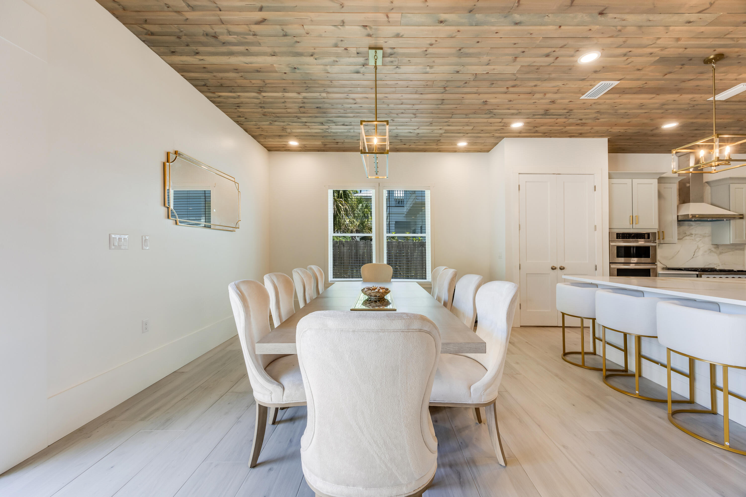41 Mobile Street Miramar Beach, FL 32550 - Photo 26 of 80 a dining room with furniture a chandelier and wooden floor