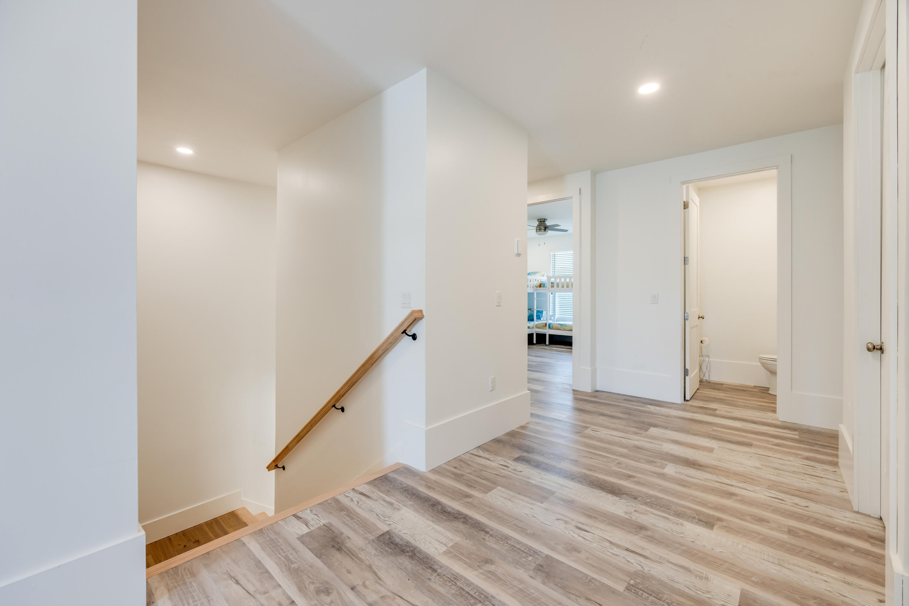 41 Mobile Street Miramar Beach, FL 32550 - Photo 36 of 80 a view of a hallway with wooden floor and entryway