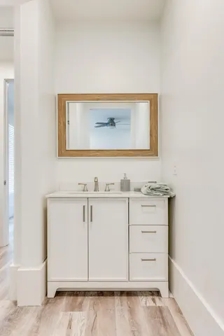 a green field with lots of trees in the background