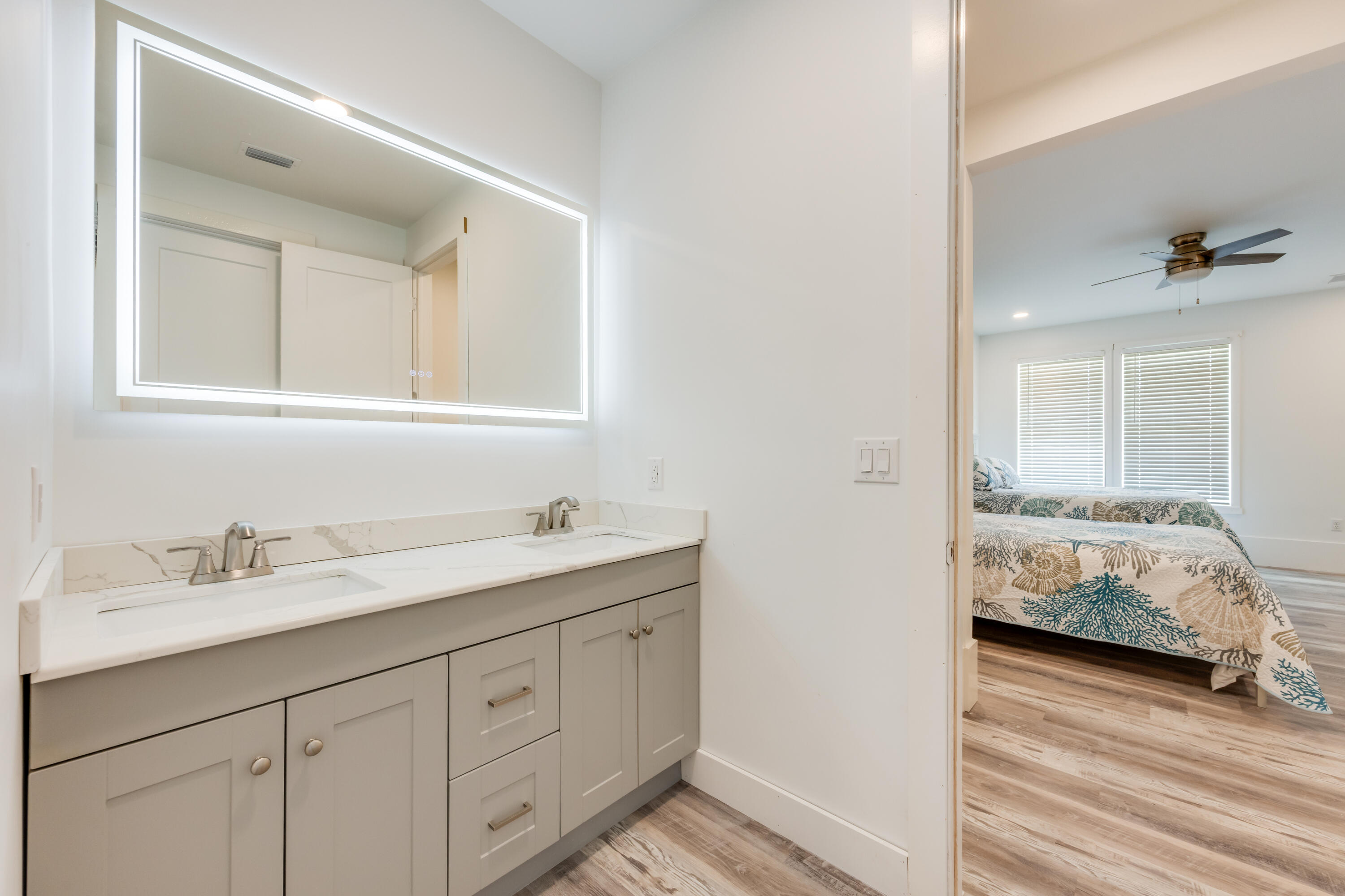 41 Mobile Street Miramar Beach, FL 32550 - Photo 58 of 80 a en suite bathroom with a double vanity sink and a mirror