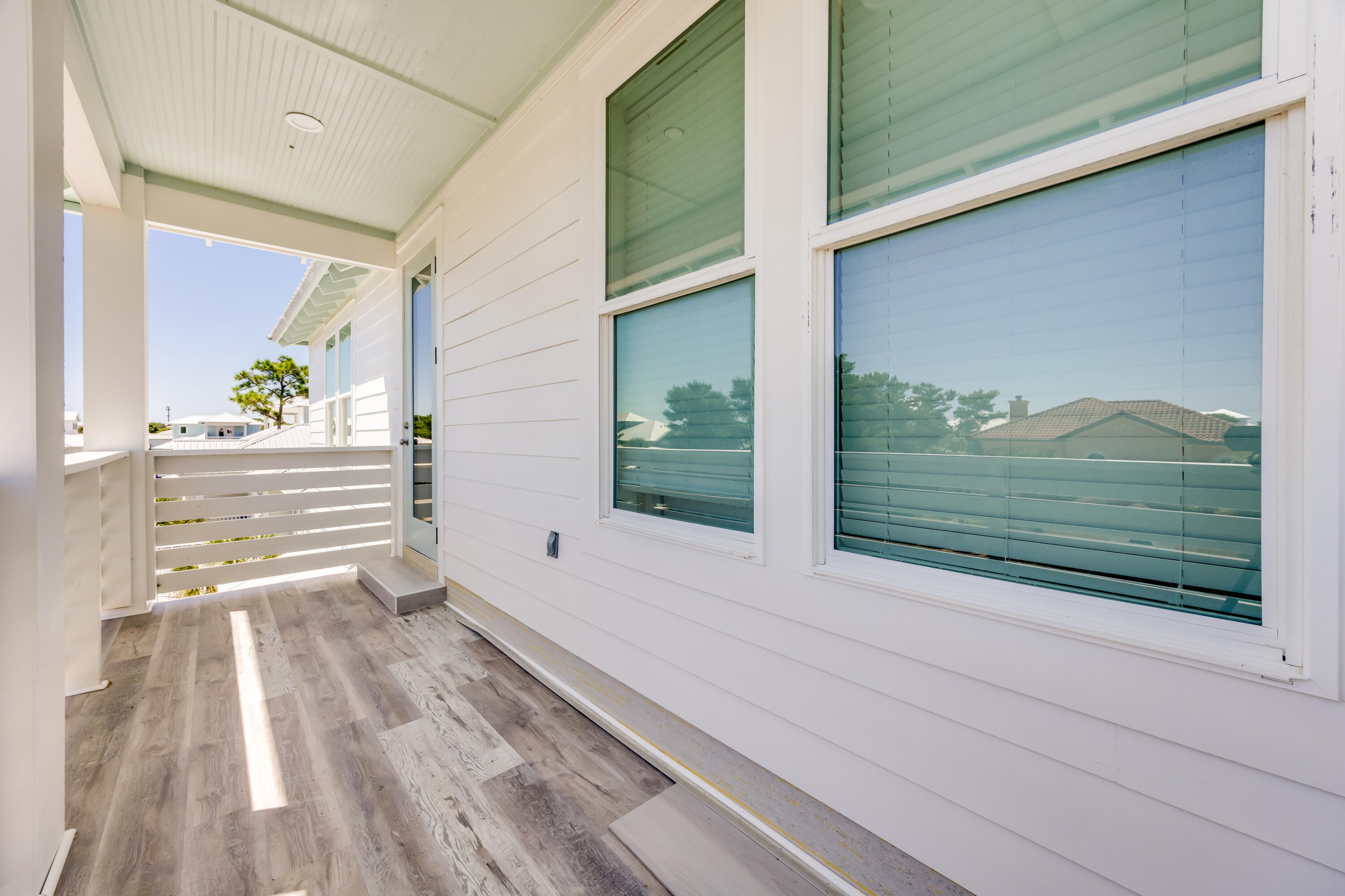 41 Mobile Street Miramar Beach, FL 32550 - Photo 68 of 80 a view of a two room with wooden floor and a bench