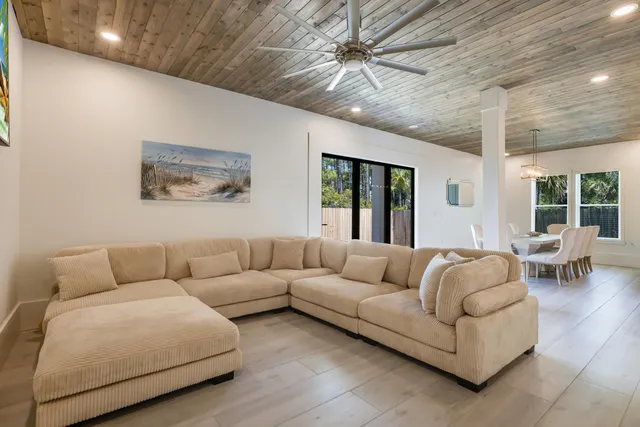 a large kitchen with a table and chairs