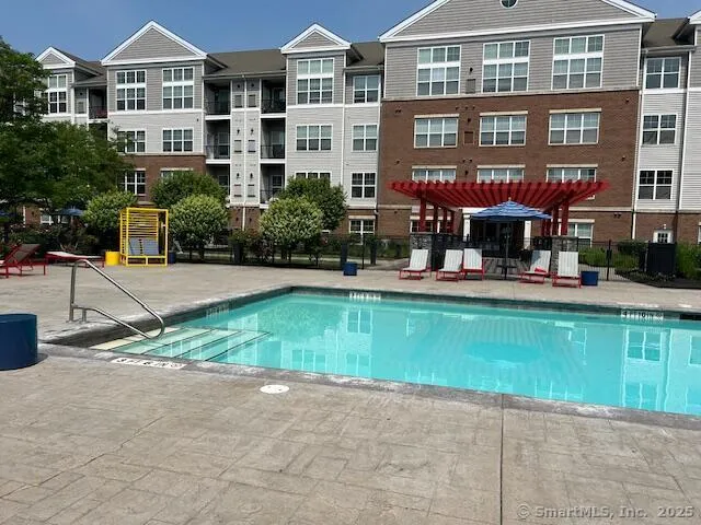 a front view of a building with garden