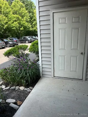 a view of a house with a small yard