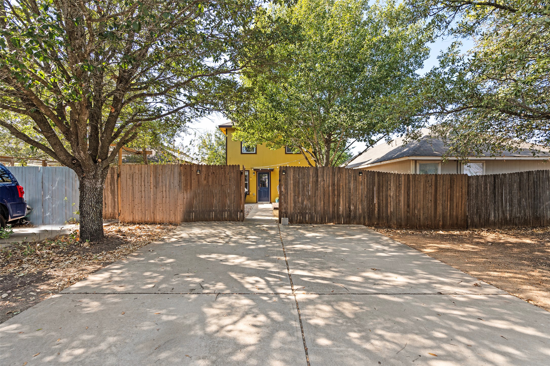 4529 Best Way Austin, TX 78725 - Photo 33 of 33 a wooden fence with trees in the background