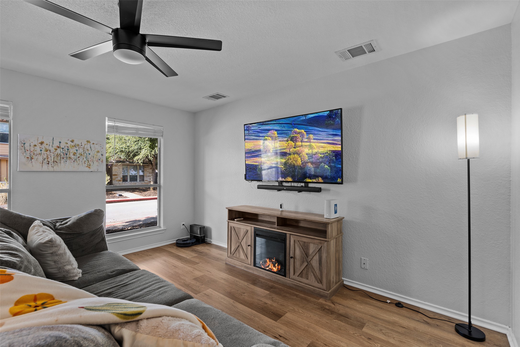 4529 Best Way Austin, TX 78725 - Photo 6 of 33 a living room with furniture and a flat screen tv