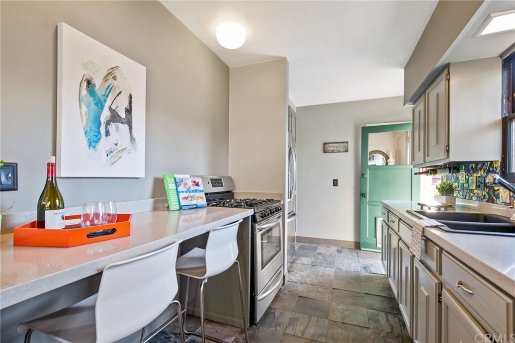 258 Termino Avenue Long Beach, CA 90803 - Photo 35 of 49 Kitchen in casita renovated with quartz counters and stainless appliances.