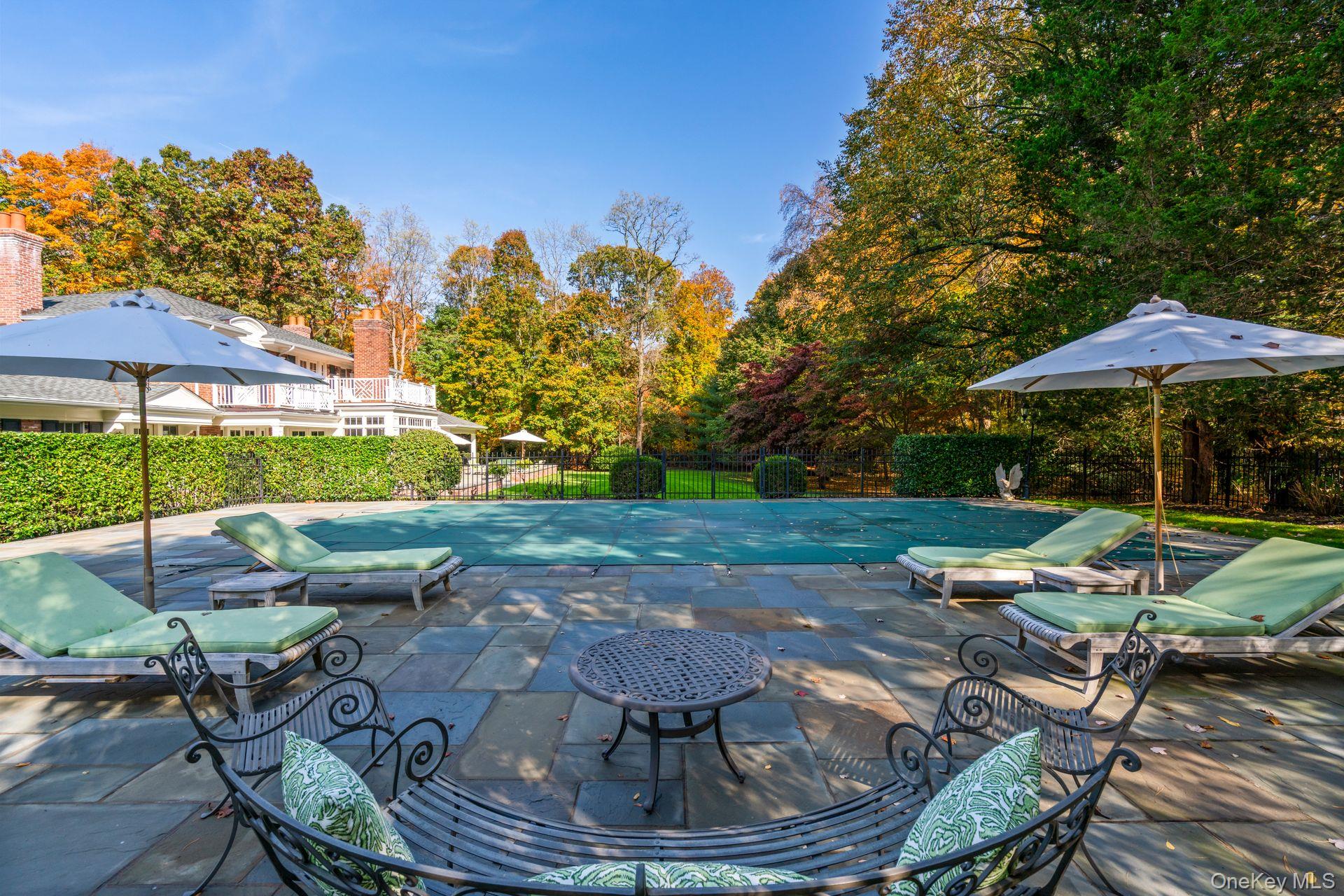 30 Underhill Road Locust Valley, NY 11560 - Photo 4 of 5 View of pool with a fenced in pool, a patio, and fence