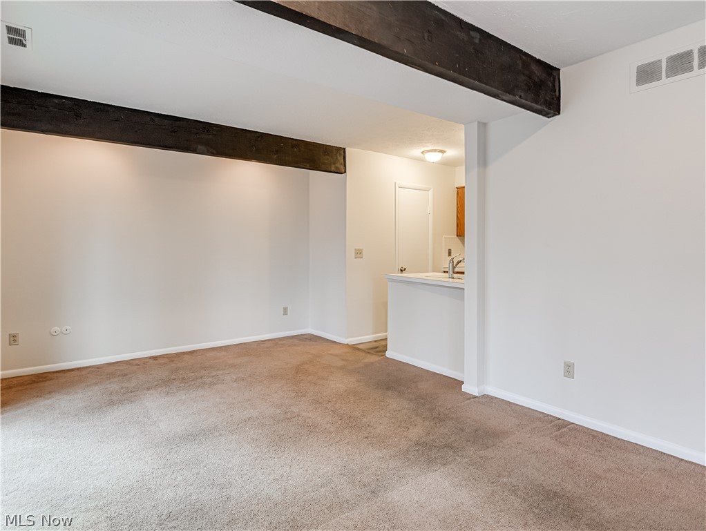 2550 Chamberlain Road, Unit A3 Akron, OH 44333 - Photo 9 of 21 Living room featuring light colored carpet