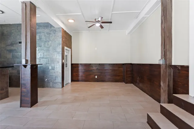 a view of an empty room with a bathroom