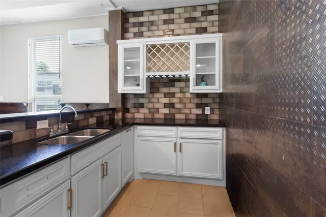 a kitchen with a sink and cabinets