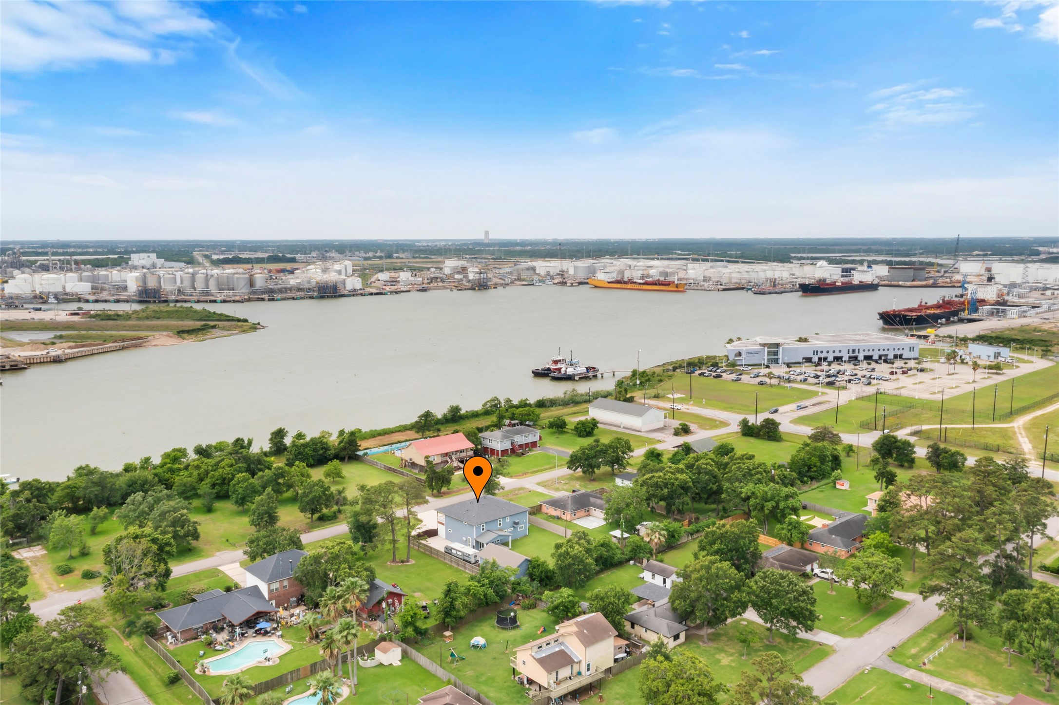 610 South Shady Lane La Porte, TX 77571 - Photo 8 of 50 Charming home near the water with a spacious yard and lush greenery. Located in a serene neighborhood with a view of Galveston Bay and nearby industrial port. Ideal for those seeking tranquility with convenient access to urban amenities.