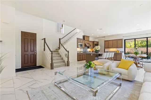 a living room with furniture and a table