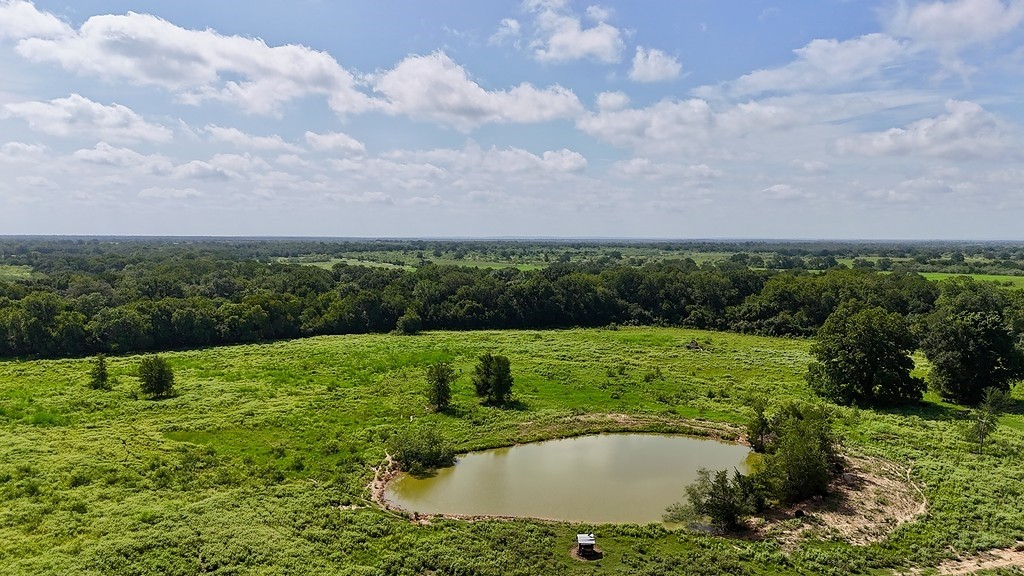 9590 Maynard Hallmark Road Flatonia, TX 78941 - Photo 3 of 31 a view of a golf course with a lake