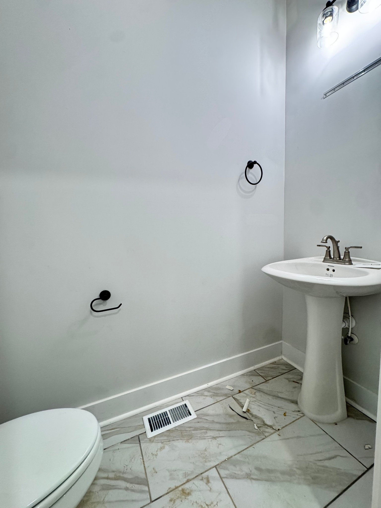 1725 Powell Road Clarksville, TN 37043 - Photo 23 of 42 a bathroom with a sink a toilet and shower