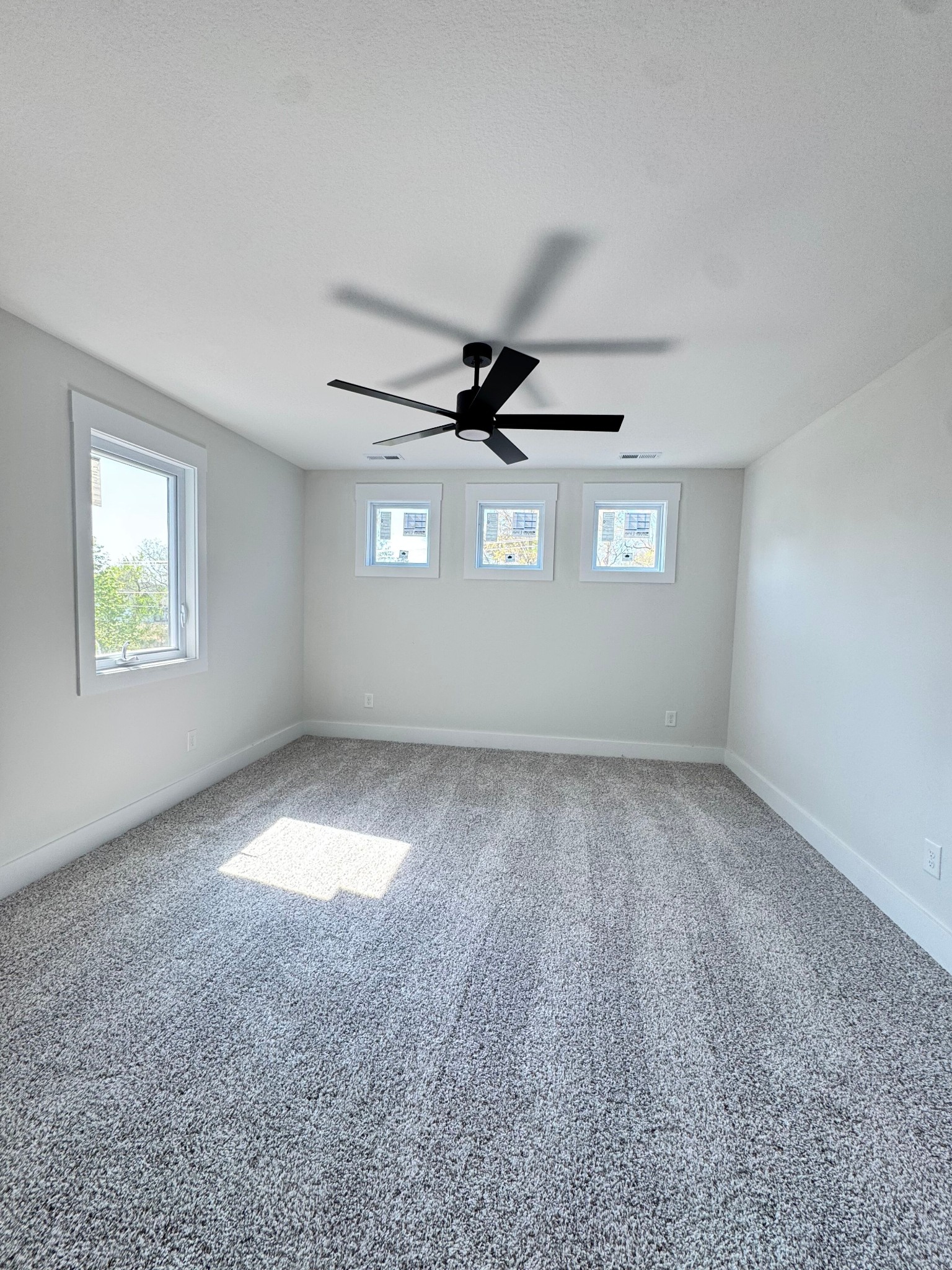 1725 Powell Road Clarksville, TN 37043 - Photo 27 of 42 an empty room with a ceiling fan and window