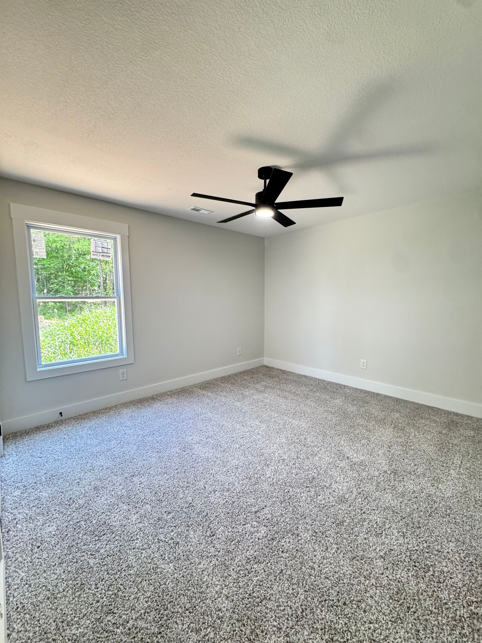 1725 Powell Road Clarksville, TN 37043 - Photo 38 of 42 an empty room with a ceiling fan and a window