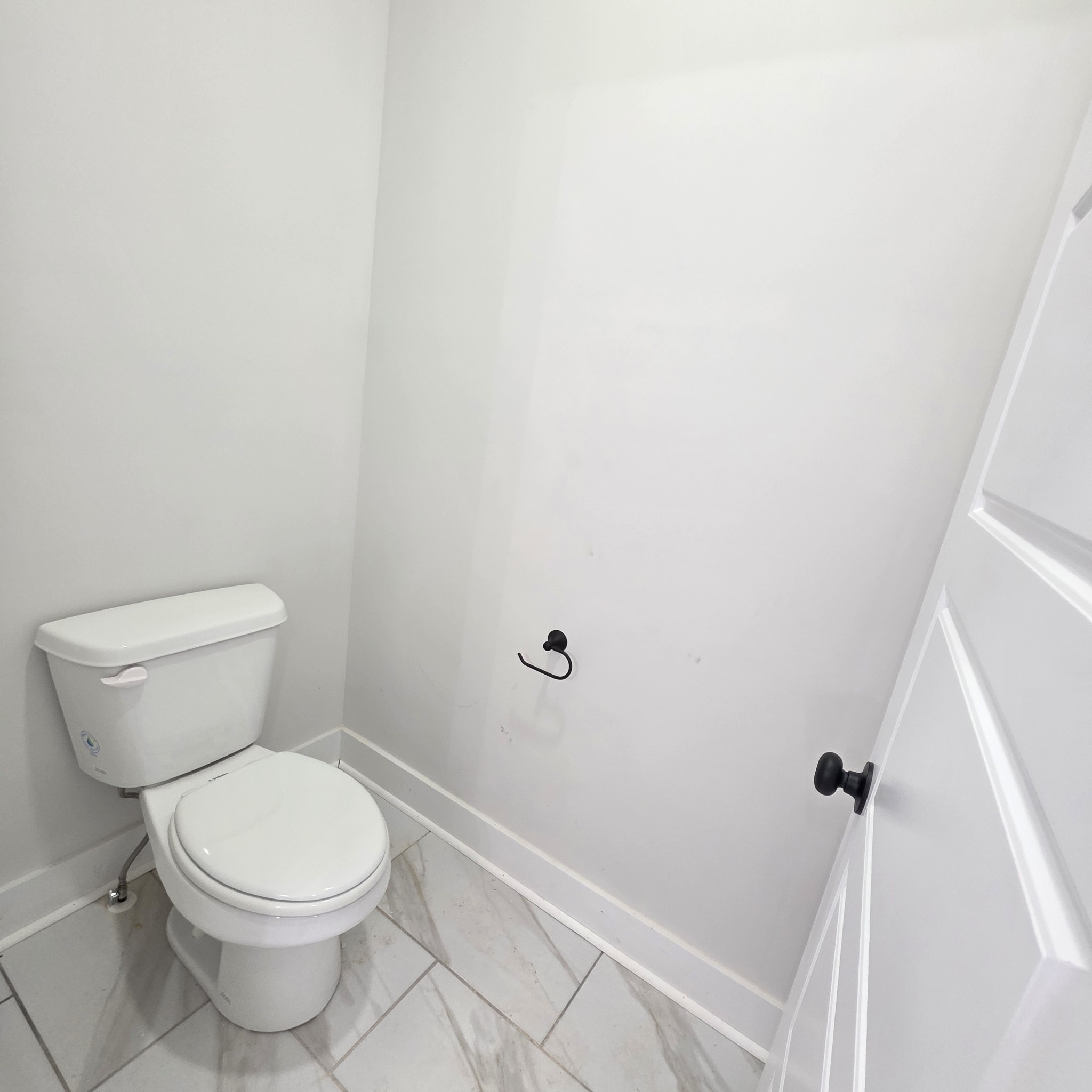 1725 Powell Road Clarksville, TN 37043 - Photo 40 of 58 a white toilet sitting next to a shower